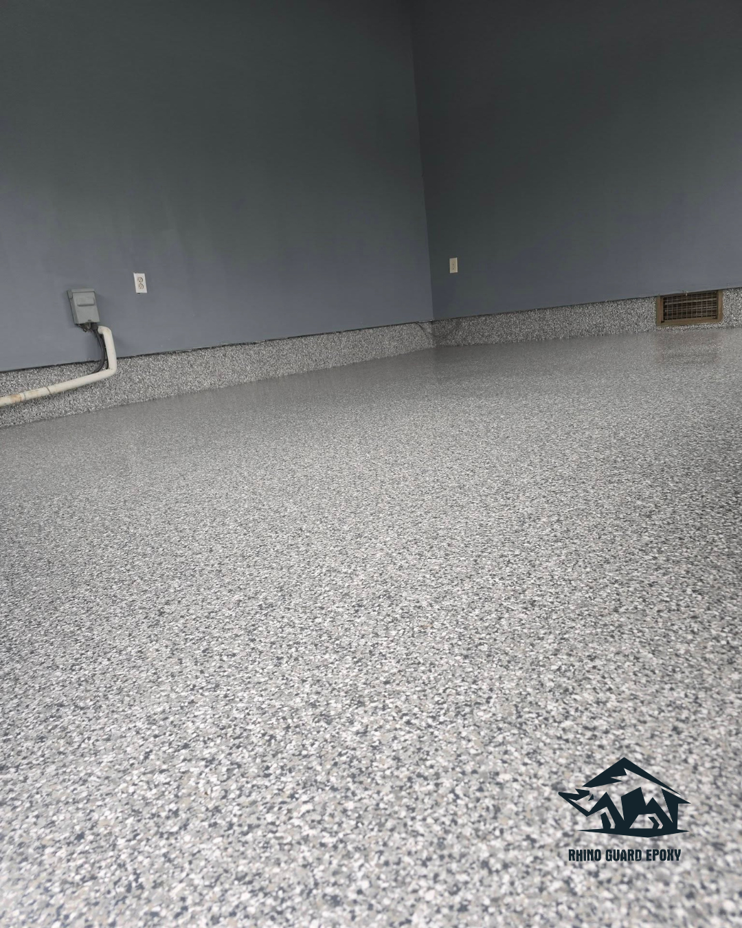 Finished garage epoxy flooring installation in Bellefontaine OH with a durable coated surface.